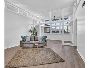 Bright living room with large windows and hardwood floors at 346 Carpenter Dr # 51, Atlanta, GA 30328