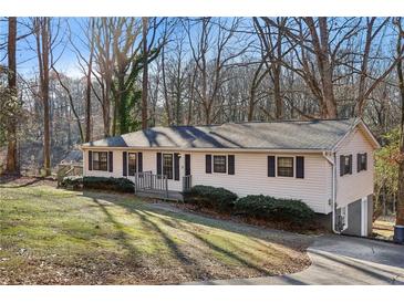 Ranch home with a large yard and mature trees at 409 Katherine Ln, Woodstock, GA 30189