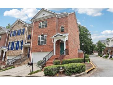 Brick front exterior of a charming townhome with landscaping at 3136 Mercer University Dr # 6, Chamblee, GA 30341