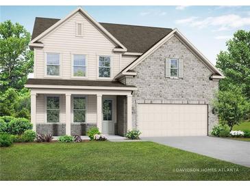 Two-story house with light beige siding, stone accents, and a covered porch at 414 Riverwood Dr, Dallas, GA 30157