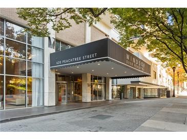 Elegant building entrance at 620 Peachtree Street with covered entrance and upscale design at 620 Peachtree Ne St # 1412, Atlanta, GA 30308