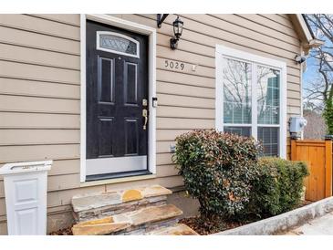Inviting home exterior with stone steps and landscaping at 5029 David Pl, Smyrna, GA 30082