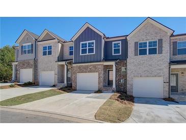 New townhome community with multiple units. Each has 2-car garage at 7004 Fringe Flower Dr # 86, Austell, GA 30168