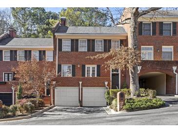 Brick front exterior of charming townhome with two-car garage at 105 Jefferson Ne Cir, Atlanta, GA 30328