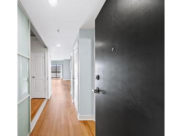 Light and bright entryway with hardwood floors and modern doors at 563 Memorial Se Dr # 405, Atlanta, GA 30312