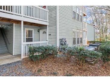 Charming condo with a private porch, well-maintained landscaping, and easy access to outdoor amenities at 2042 Brian Way, Decatur, GA 30033