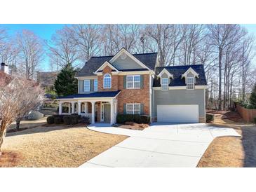 Two-story home with brick and siding exterior at 2714 Legislative Ln, Buford, GA 30519