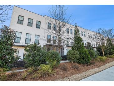 Modern white brick townhouses with landscaping at 860 Constellation Dr, Decatur, GA 30033