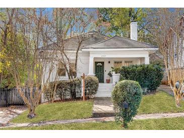 Charming white brick home with a welcoming front porch and landscaping at 1797 Hosea L Williams Se Dr, Atlanta, GA 30317