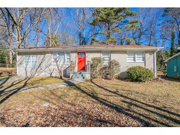 Ranch style home with red front door, gray exterior, and small yard at 454 Oak Se Dr, Atlanta, GA 30354