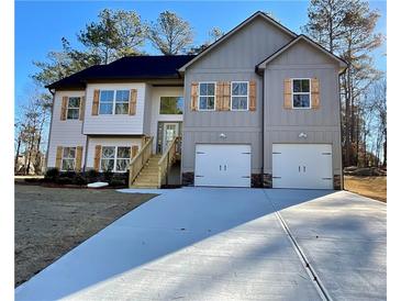 Two-story house with gray and white siding, wooden shutters, and a two-car garage at 3279 Greenhill Dr, Villa Rica, GA 30180