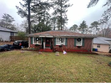 Brick ranch house with a spacious yard at 2621 Patrick Se Ct, Atlanta, GA 30317