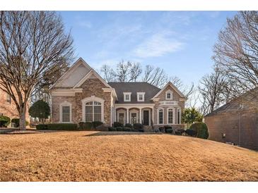 Brick house with a classic design, landscaped lawn, and a welcoming front porch at 2760 Veltre Sw Ter, Atlanta, GA 30311