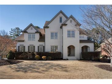 Beautiful two-story home with a well-manicured lawn and neutral colored painted brick exterior at 183 Applewood Ln, Acworth, GA 30101