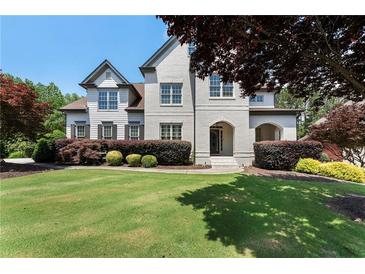 Beautiful home with a well-manicured lawn and a combination of painted and brick facade at 183 Applewood Ln, Acworth, GA 30101