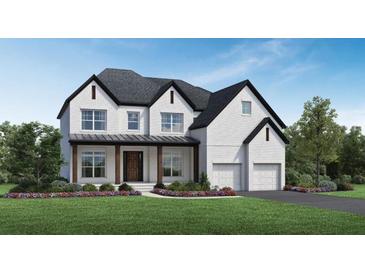 Two-story white brick home with dark trim, landscaping, and a two-car garage at 7170 Pond View Dr, Cumming, GA 30028