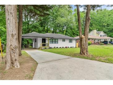 Newly renovated ranch home with a landscaped yard and driveway at 2253 Bonnybrook Sw Way, Atlanta, GA 30311