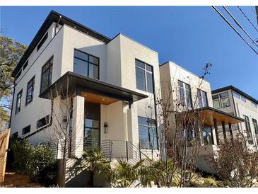 Modern white brick home with sleek lines and a covered entryway at 192 East Lake Se Ter, Atlanta, GA 30317