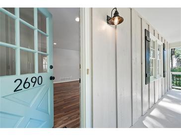 Inviting light blue front door opens to a hardwood floor interior at 2690 Old Hickory Nw Dr, Marietta, GA 30064