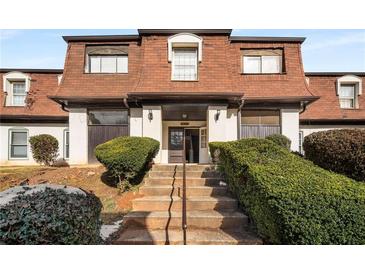 Attractive exterior of a two-story building with brick and shingle accents at 175 Rue Fontaine, Lithonia, GA 30038