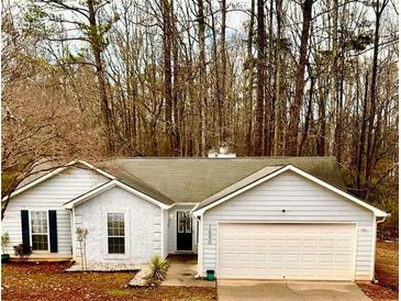 One story house with attached garage and landscaping at 1690 Hearthstone Ct, Jonesboro, GA 30236