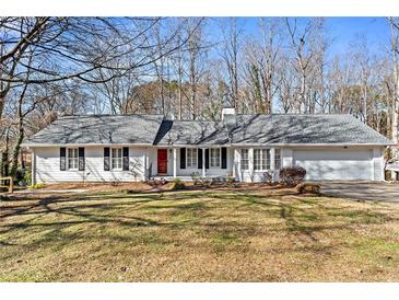 Charming one-story house with gray roof, white siding, and manicured lawn at 3781 Hickory Ridge Ct, Marietta, GA 30066