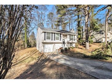 Cute ranch home with a carport and mature trees at 5224 Martins Crossing Rd, Stone Mountain, GA 30088