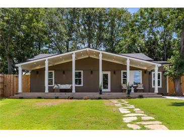 Ranch style home with covered porch and stone walkway at 1102 Fountain Sw Dr, Atlanta, GA 30314