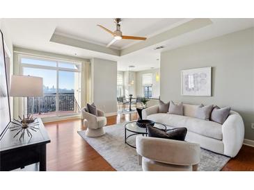 Spacious living room with hardwood floors and city views at 325 E Paces Ferry Ne Rd # 1608, Atlanta, GA 30305