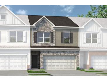 Two-story townhome with stone and siding exterior, two-car garage, and landscaping at 209 Bastian Dr # 4, Villa Rica, GA 30180