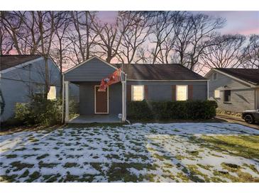 Charming gray bungalow with a covered porch, and manicured lawn, freshly painted at 1327 Hosea L Williams Se Dr, Atlanta, GA 30317