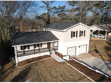 Newly renovated house with a large backyard, two-car garage, and spacious front porch at 3606 Columbia Pkwy, Decatur, GA 30034