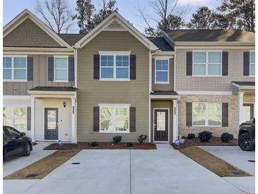 Modern townhouse exterior with neutral colors and a 2-car driveway at 4336 Mallory Ct, Union City, GA 30291