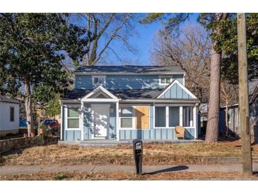 Newly renovated light blue house with front porch and yard at 1095 Mcdaniel Sw St, Atlanta, GA 30310