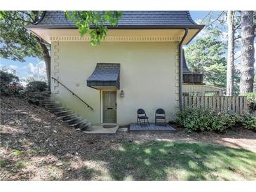 Private entrance with stairs leading to a patio and small yard at 141 Maison Nw Pl, Atlanta, GA 30327