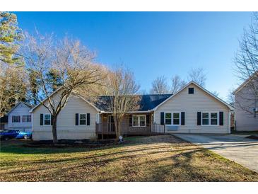 Ranch style home with mature trees and a spacious yard at 1390 Willow Bend Dr, Snellville, GA 30078