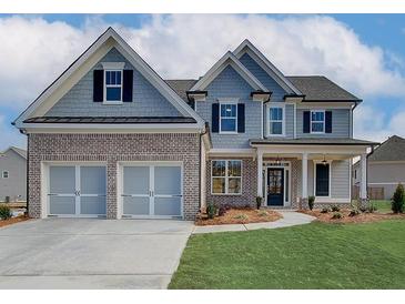 Two-story house with gray siding, brick accents, and a three-car garage at 441 Pine Way, Dallas, GA 30157