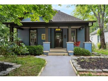 Charming blue bungalow with a welcoming front porch at 120 Howard Se St, Atlanta, GA 30317
