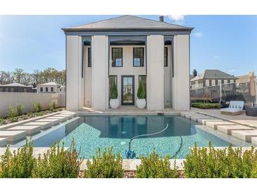 Luxury home with a stunning pool and elegant exterior design at 260 Guild Ln, Fayetteville, GA 30214