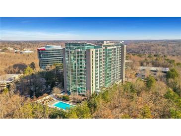 Luxury high-rise condo building with pool and scenic views at 3300 Windy Ridge Se Pkwy # 1603, Atlanta, GA 30339