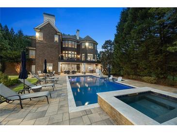 Luxury home with inviting pool, spa, and lounge area at 1358 Wynbrook Trce, Smyrna, GA 30126