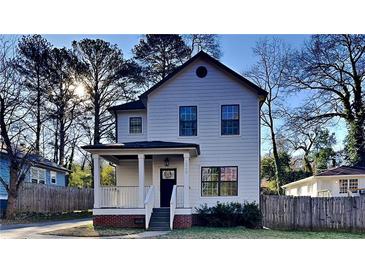 Charming two-story house with a front porch and landscaped lawn at 2548 Bellview Nw Ave, Atlanta, GA 30318