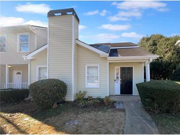 Inviting exterior of charming house, featuring a well-maintained lawn and walkway at 2190 Wellington Cir, Lithonia, GA 30058