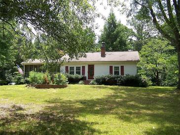 Charming one-story home with a spacious yard and mature trees at 4038 Wesley Chapel Rd, Marietta, GA 30062