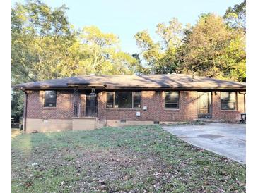 Brick ranch home with a spacious yard at 1214 Lloyd Dr, Forest Park, GA 30297