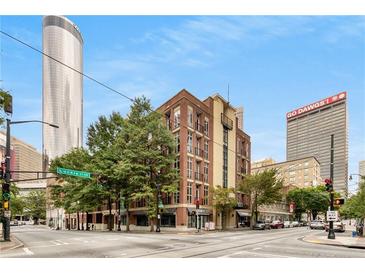 Brick building exterior with large windows and balconies at 123 Luckie Nw St # 2210, Atlanta, GA 30303