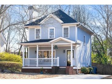 Charming two-story home with a welcoming front porch and a well-maintained yard at 110 Bowen Sw Cir, Atlanta, GA 30315
