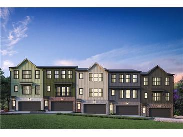 Modern townhouses with varying exterior colors and attached garages at 425 Firefly Cir # 42, Alpharetta, GA 30009