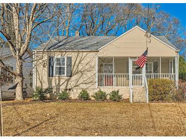 Charming ranch home with screened porch and landscaped yard at 461 Trabert Nw Ave, Atlanta, GA 30309