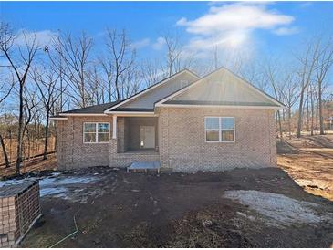 Brick house with front porch and landscaping at 3383 Milan Ct, Douglasville, GA 30135